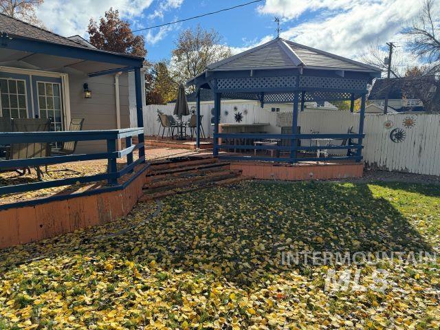 view of yard with a gazebo and a deck