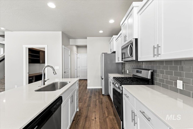 4084 E Blueberry St, Meridian, ID 83642 - kitchen featuring appliances with stainless steel finishes, a sink, white cabinetry, light countertops, and recessed lighting