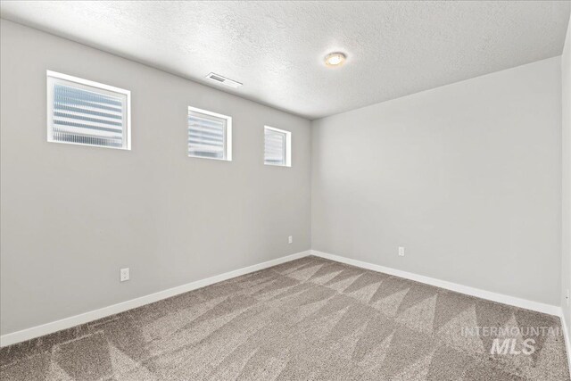 4084 E Blueberry St, Meridian, ID 83642 - spare room with a textured ceiling, carpet, and baseboards
