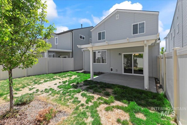 4084 E Blueberry St, Meridian, ID 83642 - back of house featuring a patio and a fenced backyard