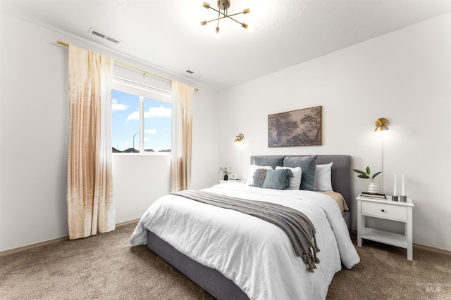 bedroom featuring visible vents, baseboards, and carpet floors