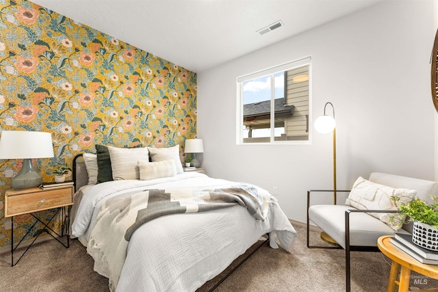 bedroom featuring visible vents, carpet flooring, and wallpapered walls