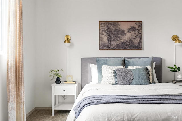 carpeted bedroom with baseboards