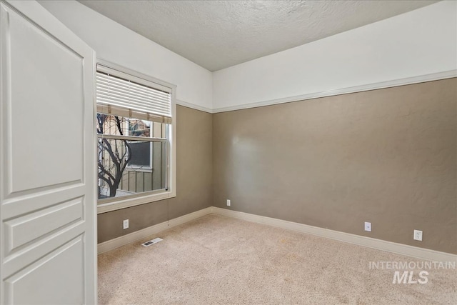 1280 W Bacall St, Meridian, ID 83646 - carpeted empty room with a textured ceiling, visible vents, and baseboards