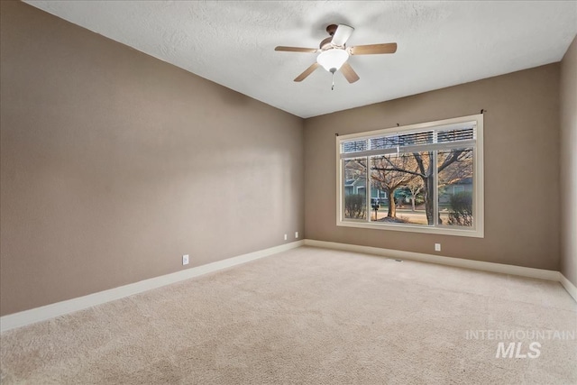 1280 W Bacall St, Meridian, ID 83646 - spare room with a ceiling fan, a textured ceiling, light carpet, and baseboards