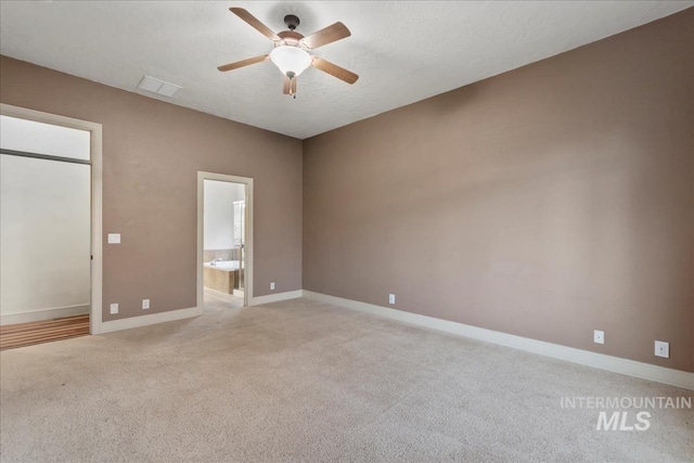 1280 W Bacall St, Meridian, ID 83646 - unfurnished room with baseboards, visible vents, light carpet, and ceiling fan