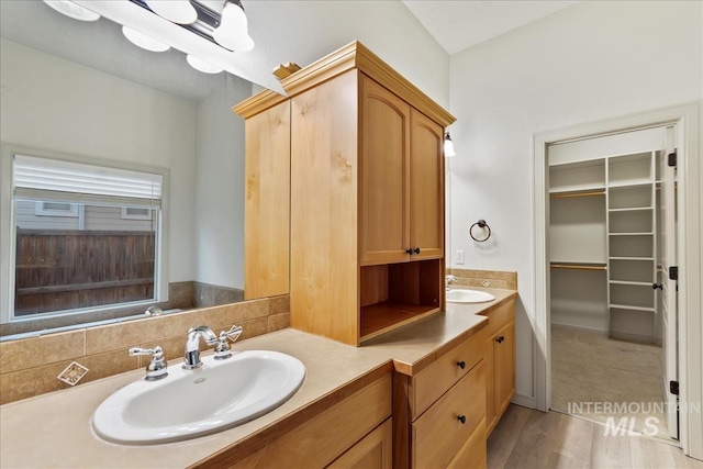 1280 W Bacall St, Meridian, ID 83646 - full bath with a walk in closet, double vanity, a sink, and wood finished floors