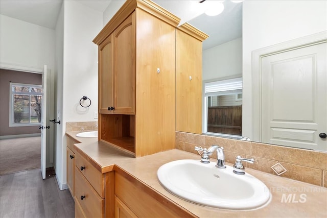 1280 W Bacall St, Meridian, ID 83646 - bathroom featuring double vanity, wood finished floors, and a sink