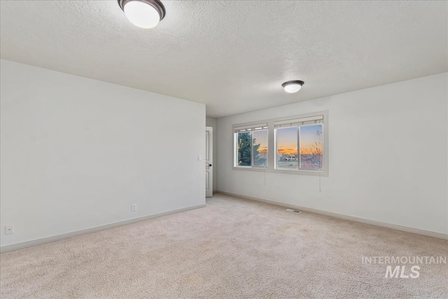 1280 W Bacall St, Meridian, ID 83646 - spare room with a textured ceiling, light colored carpet, and baseboards