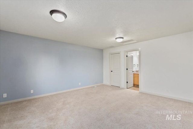 1280 W Bacall St, Meridian, ID 83646 - unfurnished room with a textured ceiling, baseboards, and light carpet