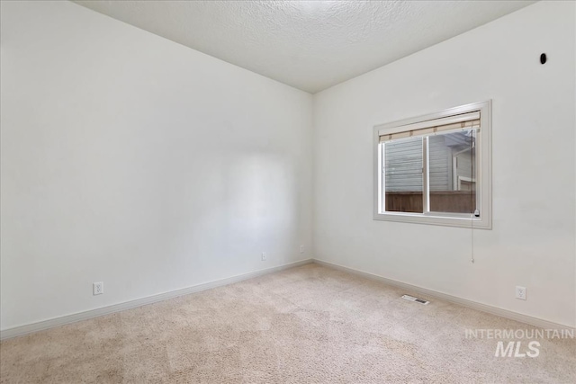 1280 W Bacall St, Meridian, ID 83646 - spare room with a textured ceiling, visible vents, carpet floors, and baseboards