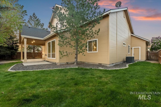 1280 W Bacall St, Meridian, ID 83646 - rear view of house featuring fence, cooling unit, a patio area, and a yard