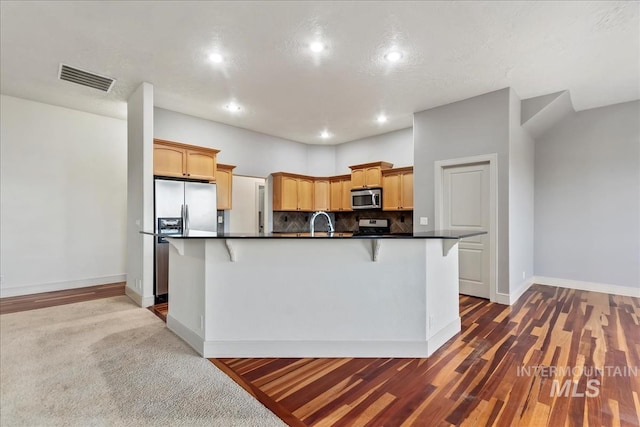 1280 W Bacall St, Meridian, ID 83646 - kitchen with appliances with stainless steel finishes, visible vents, dark countertops, and baseboards