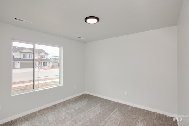 view of carpeted spare room