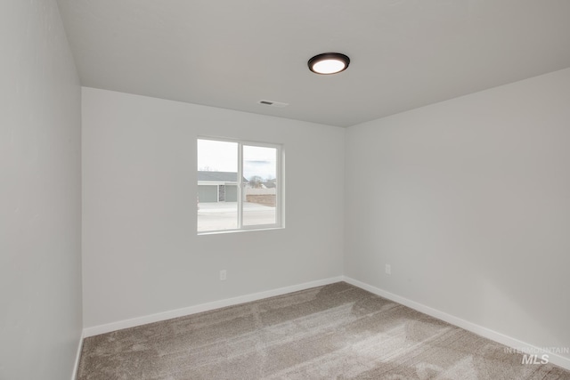 empty room featuring carpet floors