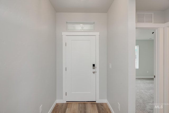 doorway with light hardwood / wood-style flooring