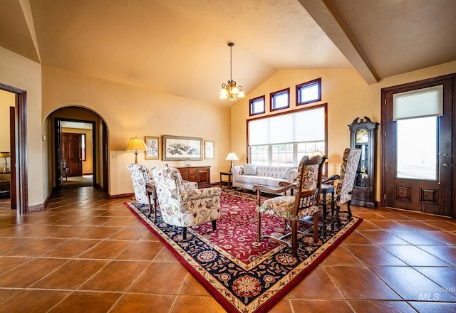 186 Ridgeview Dr, Grangeville, ID 83530 - tiled living room featuring a wealth of natural light, arched walkways, baseboards, and an inviting chandelier