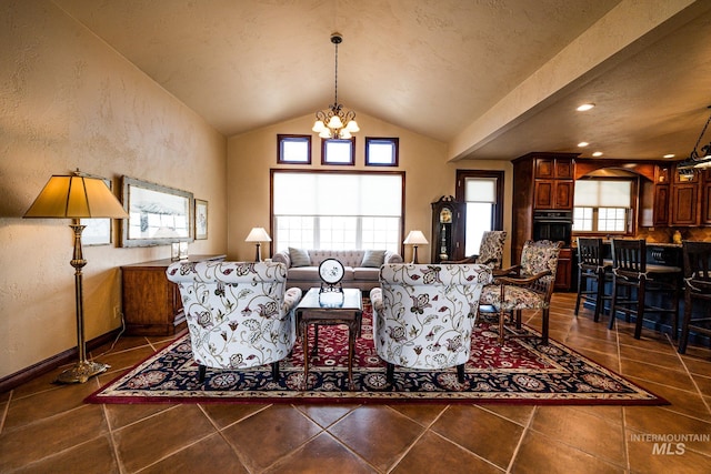 186 Ridgeview Dr, Grangeville, ID 83530 - living area with dark tile patterned floors, a notable chandelier, a textured wall, and lofted ceiling