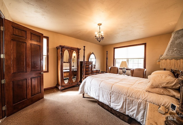 186 Ridgeview Dr, Grangeville, ID 83530 - bedroom featuring an inviting chandelier, baseboards, and carpet flooring