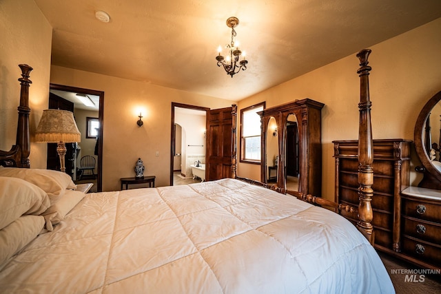 186 Ridgeview Dr, Grangeville, ID 83530 - bedroom with arched walkways and an inviting chandelier