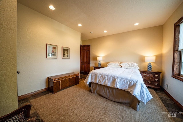 186 Ridgeview Dr, Grangeville, ID 83530 - bedroom featuring baseboards, recessed lighting, and a textured wall