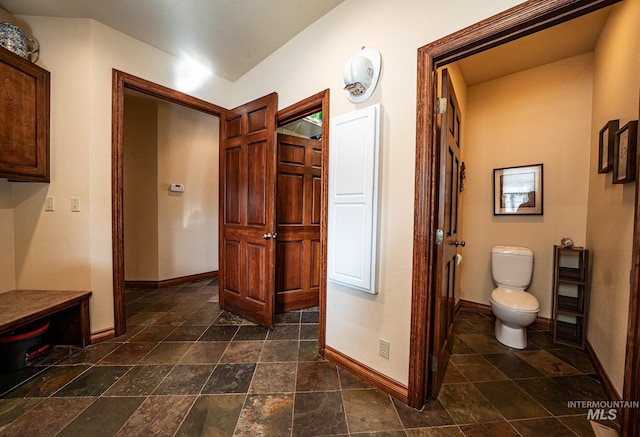 186 Ridgeview Dr, Grangeville, ID 83530 - bathroom with toilet, stone finish floor, and baseboards