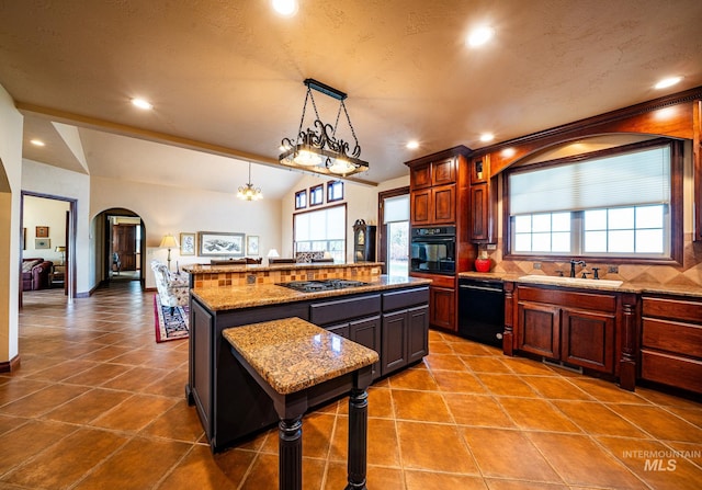 186 Ridgeview Dr, Grangeville, ID 83530 - kitchen featuring arched walkways, plenty of natural light, a sink, and black appliances