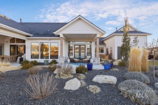 back of house featuring french doors