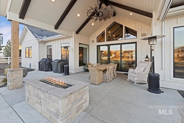 view of patio / terrace with ceiling fan, an outdoor fire pit, and area for grilling