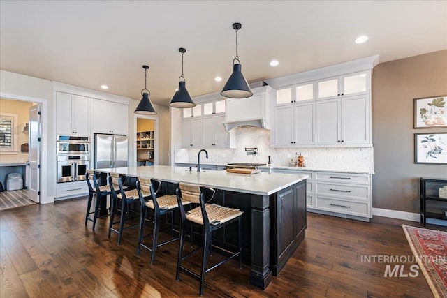 kitchen featuring sink, white cabinetry, and stainless steel appliances