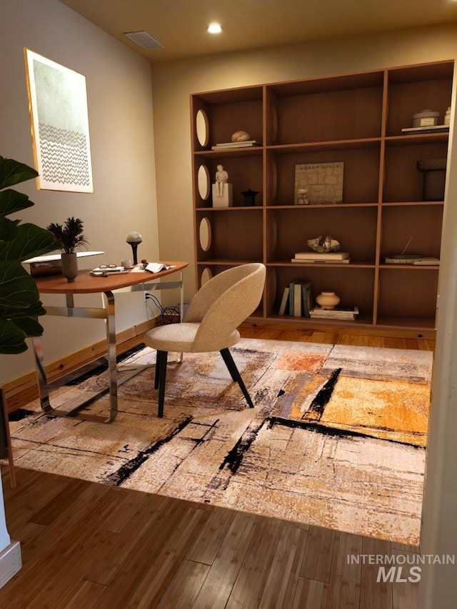 office with hardwood / wood-style flooring, visible vents, and recessed lighting