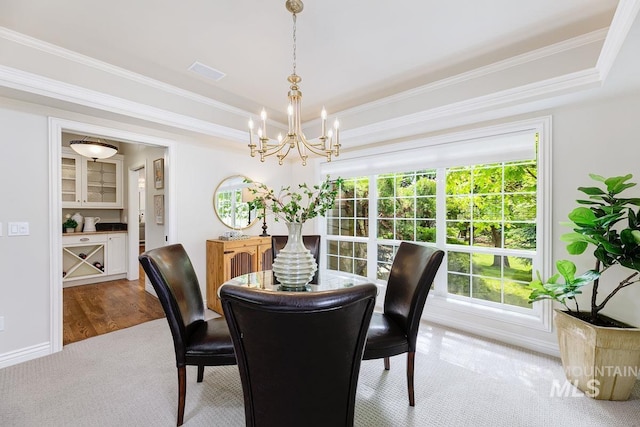 2417 E Brigantine Ct, Eagle, ID 83616 - carpeted dining space featuring a chandelier, a raised ceiling, crown molding, and baseboards