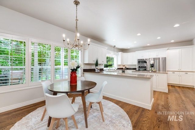 2417 E Brigantine Ct, Eagle, ID 83616 - dining room with a chandelier, light wood-style flooring, recessed lighting, and baseboards