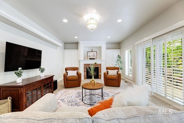 2417 E Brigantine Ct, Eagle, ID 83616 - living area with carpet flooring, recessed lighting, a fireplace, a chandelier, and baseboards