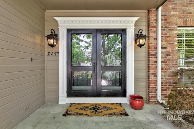 2417 E Brigantine Ct, Eagle, ID 83616 - view of exterior entry featuring french doors and brick siding
