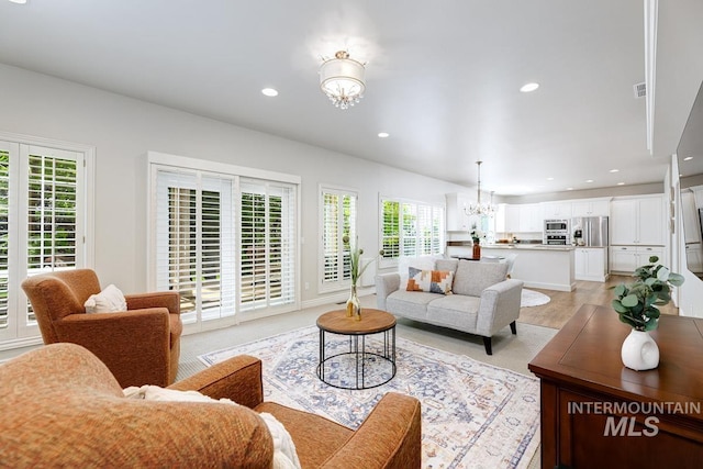 2417 E Brigantine Ct, Eagle, ID 83616 - living area with a chandelier, plenty of natural light, and recessed lighting