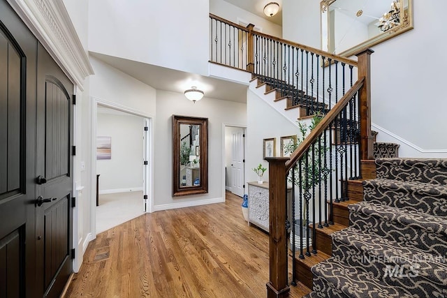 2417 E Brigantine Ct, Eagle, ID 83616 - entryway featuring a high ceiling, light wood finished floors, stairs, and baseboards
