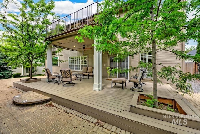 2417 E Brigantine Ct, Eagle, ID 83616 - wooden terrace with a ceiling fan and an outdoor hangout area