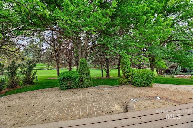 2417 E Brigantine Ct, Eagle, ID 83616 - view of community featuring a lawn and a patio