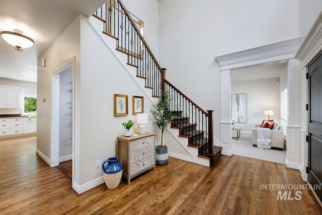 2417 E Brigantine Ct, Eagle, ID 83616 - foyer with wood finished floors, stairway, baseboards, and a high ceiling
