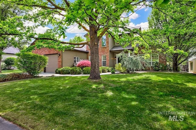 2417 E Brigantine Ct, Eagle, ID 83616 - view of property hidden behind natural elements with brick siding, a front yard, and an attached garage