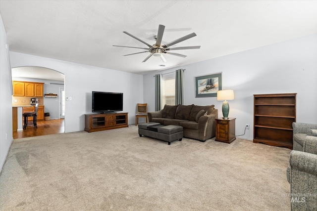 2023 E Wrightwood Dr, Meridian, ID 83642 - living area with ceiling fan, arched walkways, and light carpet