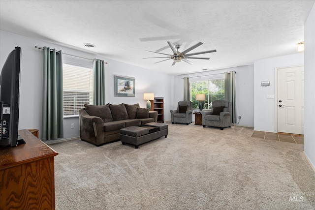 2023 E Wrightwood Dr, Meridian, ID 83642 - carpeted living area with ceiling fan and baseboards
