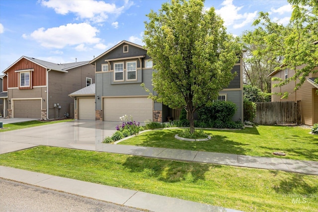 2023 E Wrightwood Dr, Meridian, ID 83642 - view of front of property with an attached garage, stone siding, board and batten siding, and concrete driveway