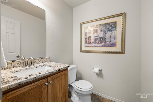 2023 E Wrightwood Dr, Meridian, ID 83642 - bathroom with toilet, baseboards, vanity, and tile patterned floors