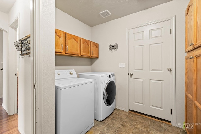 2023 E Wrightwood Dr, Meridian, ID 83642 - laundry area featuring independent washer and dryer, cabinet space, and baseboards