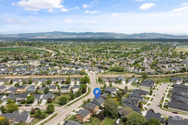 2023 E Wrightwood Dr, Meridian, ID 83642 - aerial view of property and surrounding area with a mountain backdrop and nearby suburban area