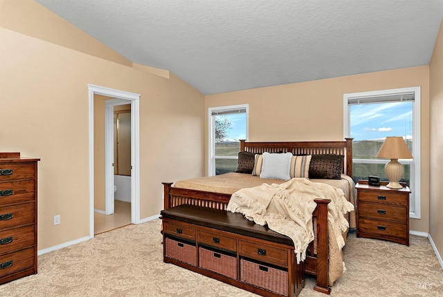 11610 W Lanktree Gulch Rd, Star, ID 83669 - bedroom with light carpet, baseboards, vaulted ceiling, and a textured ceiling