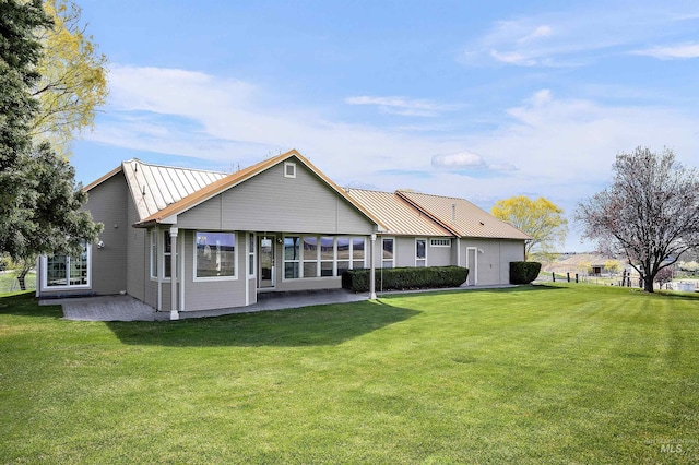 11610 W Lanktree Gulch Rd, Star, ID 83669 - back of house with metal roof, a standing seam roof, a yard, and a patio area