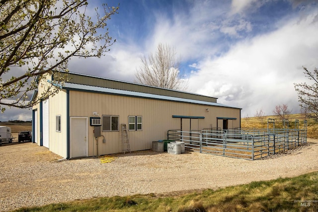 11610 W Lanktree Gulch Rd, Star, ID 83669 - view of outdoor structure with an exterior structure, an outbuilding, a garage, and a wall mounted air conditioner